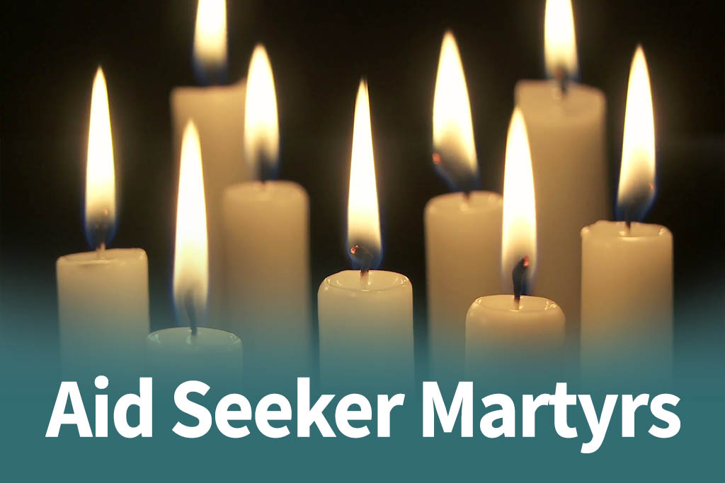 Candles with the text "aid seeker martyrs" to honor their memory.